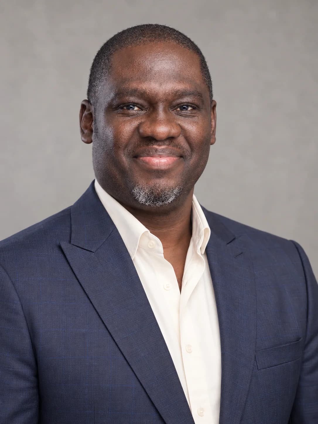 Formal editorial portrait of Ayodeji Peter Falope